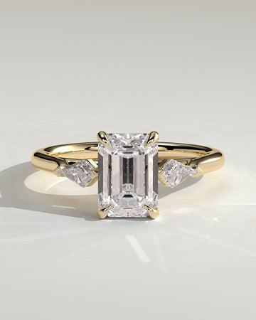 2.0CT Emerald Cut Lab Grown Diamond Trilogy With Kite Side Stones Engagement Ring