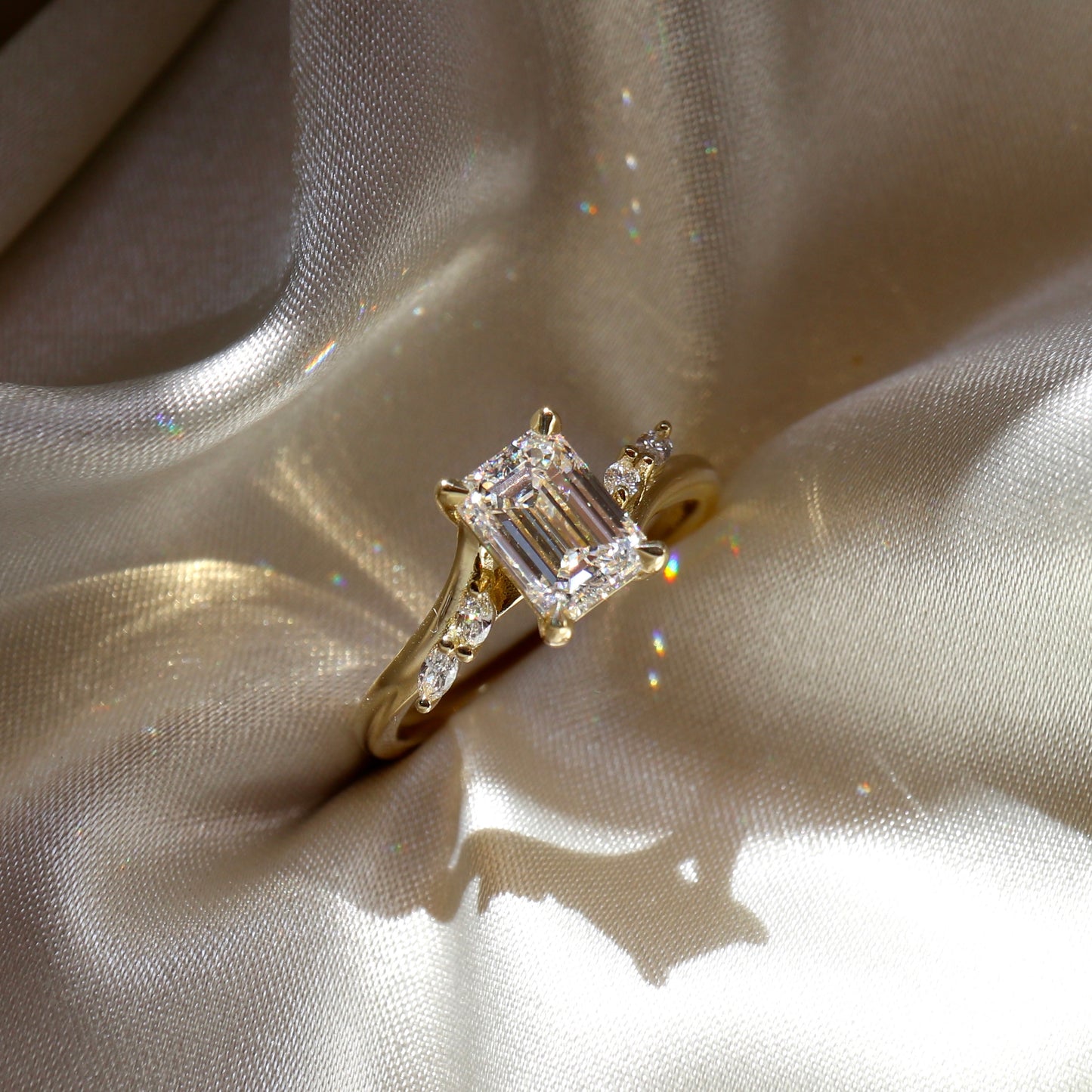 2.0CT Emerald Cut Lab Grown Diamond With Marquise Accents Twisted Engagement Ring