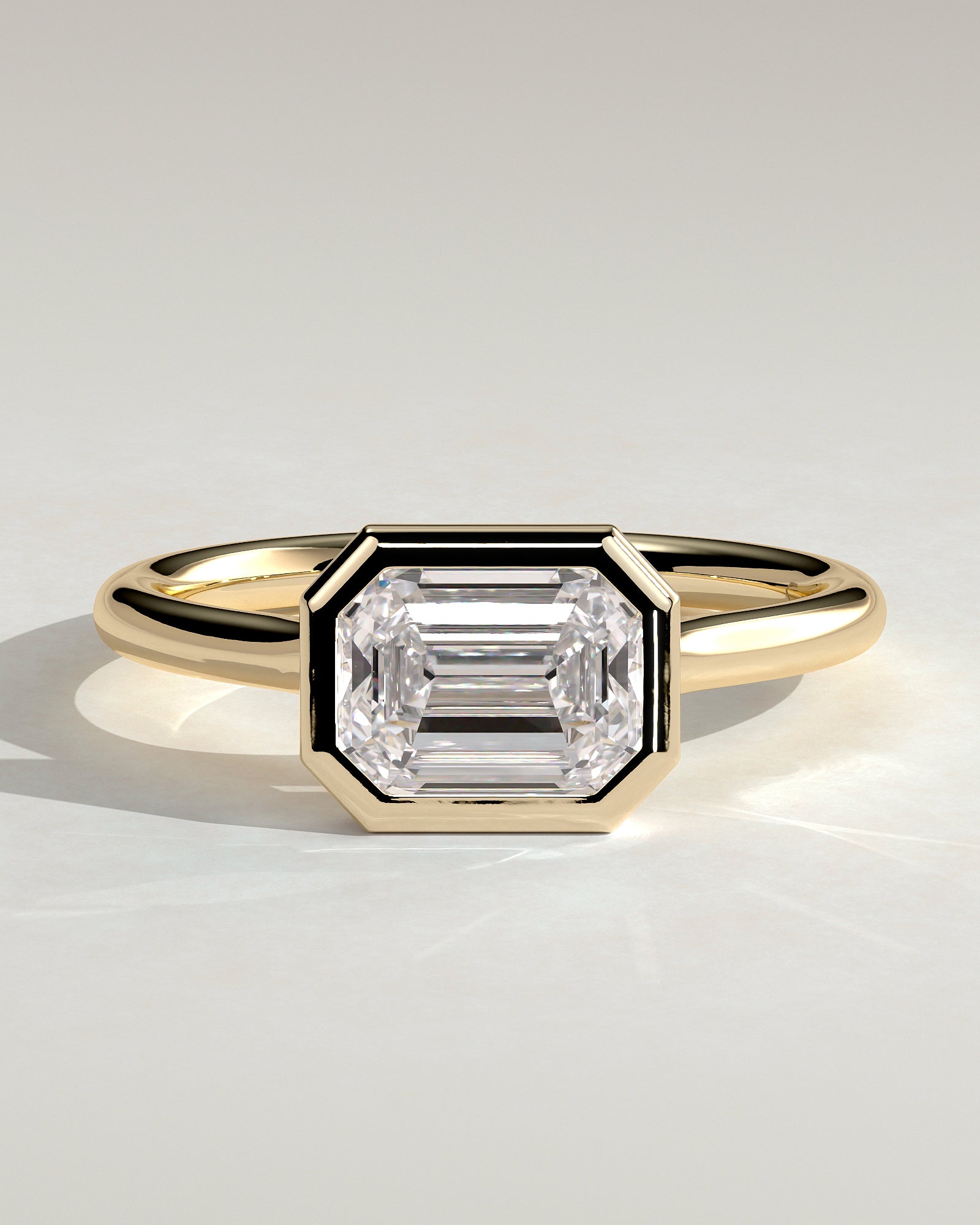 2.0CT Half Bezel Set Emerald Cut Lab Grown Diamond East West Cathedral Engagement Ring
