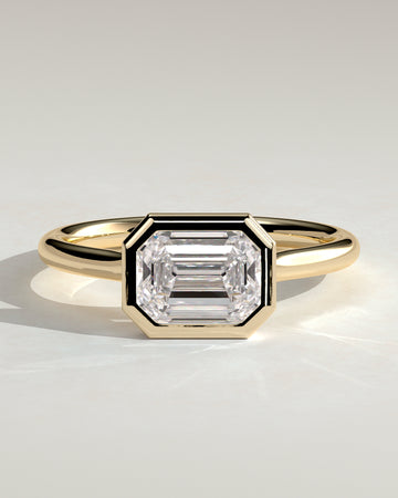 2.0CT Half Bezel Set Emerald Cut Lab Grown Diamond East West Cathedral Engagement Ring