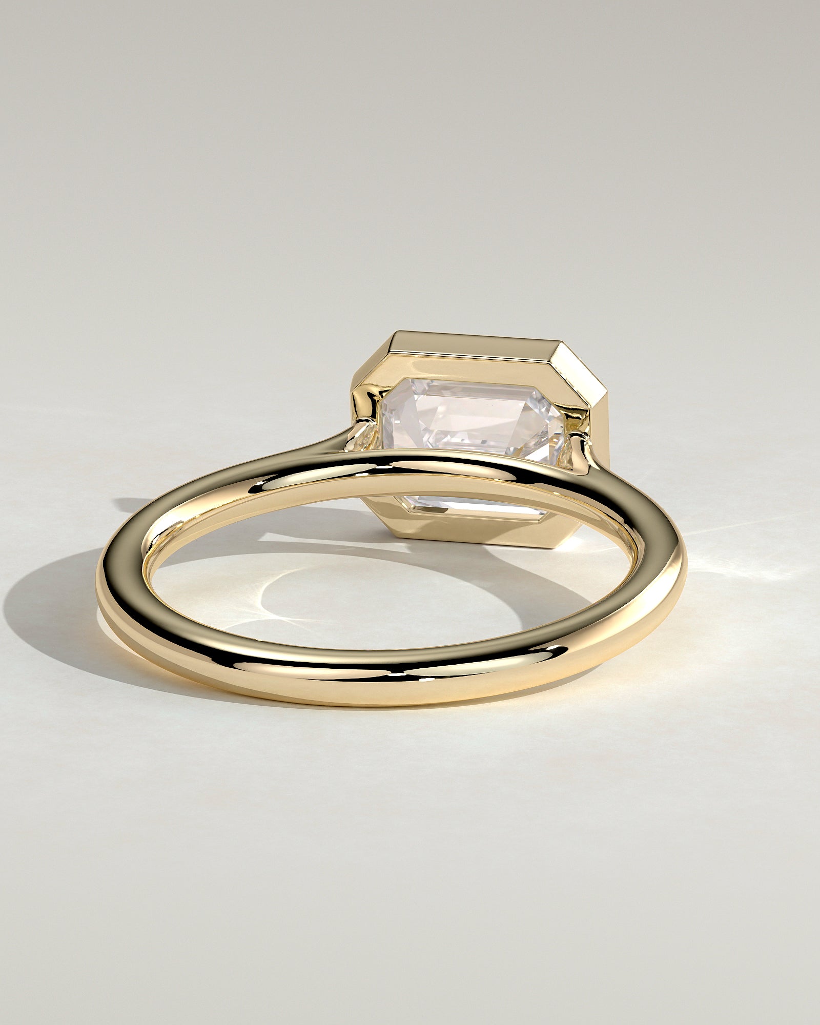 2.0CT Half Bezel Set Emerald Cut Lab Grown Diamond East West Cathedral Engagement Ring