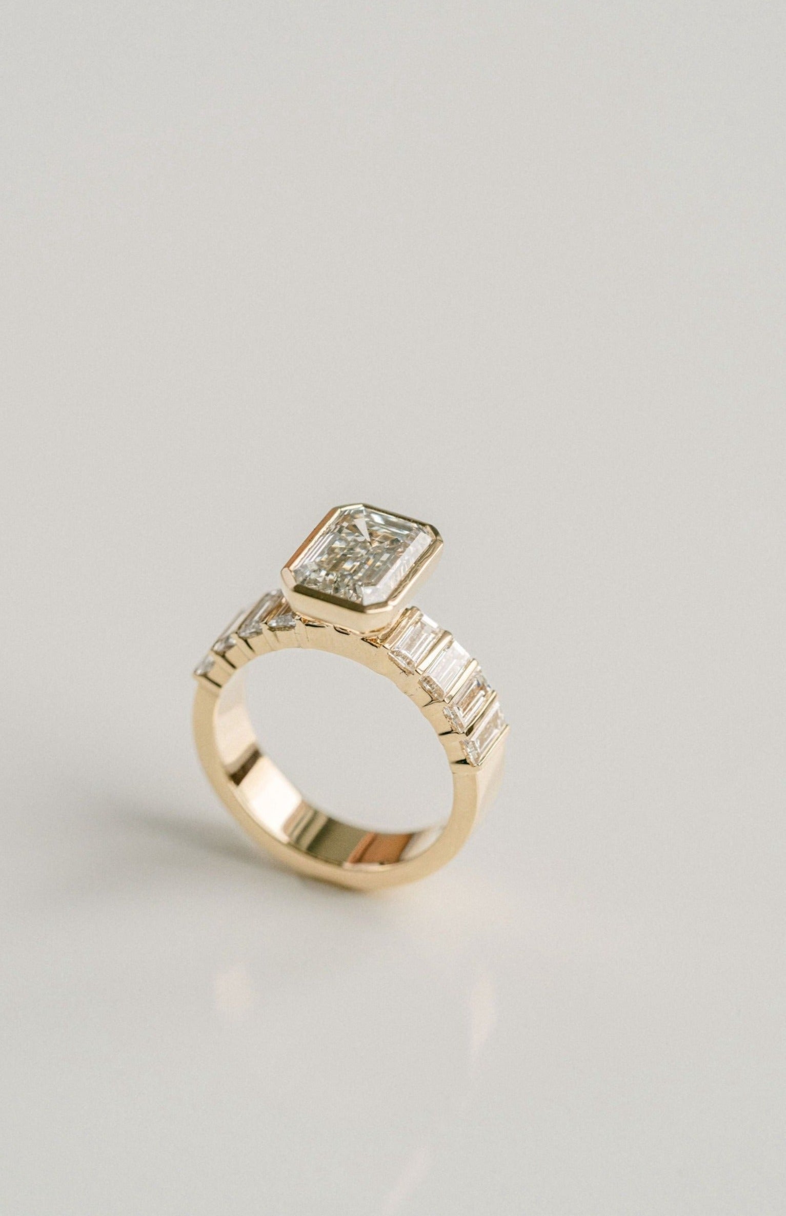 3.0CT Bezel Set Emerald Cut With Bar Set Baguette Lab Diamond 5mm Band Engagement Ring