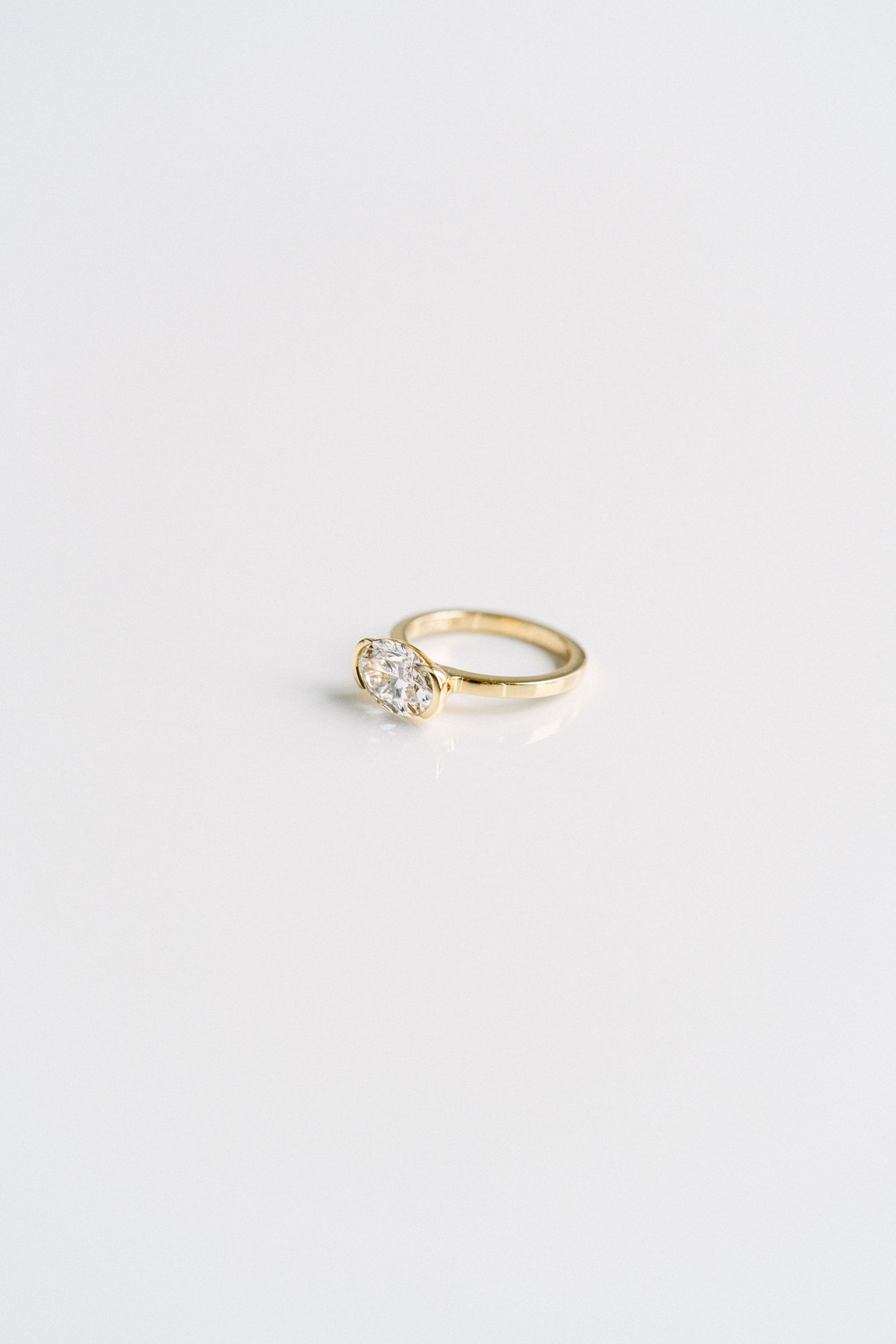 2.50CT Oval Lab Grown Diamond East West Half Bezel Engagement Ring