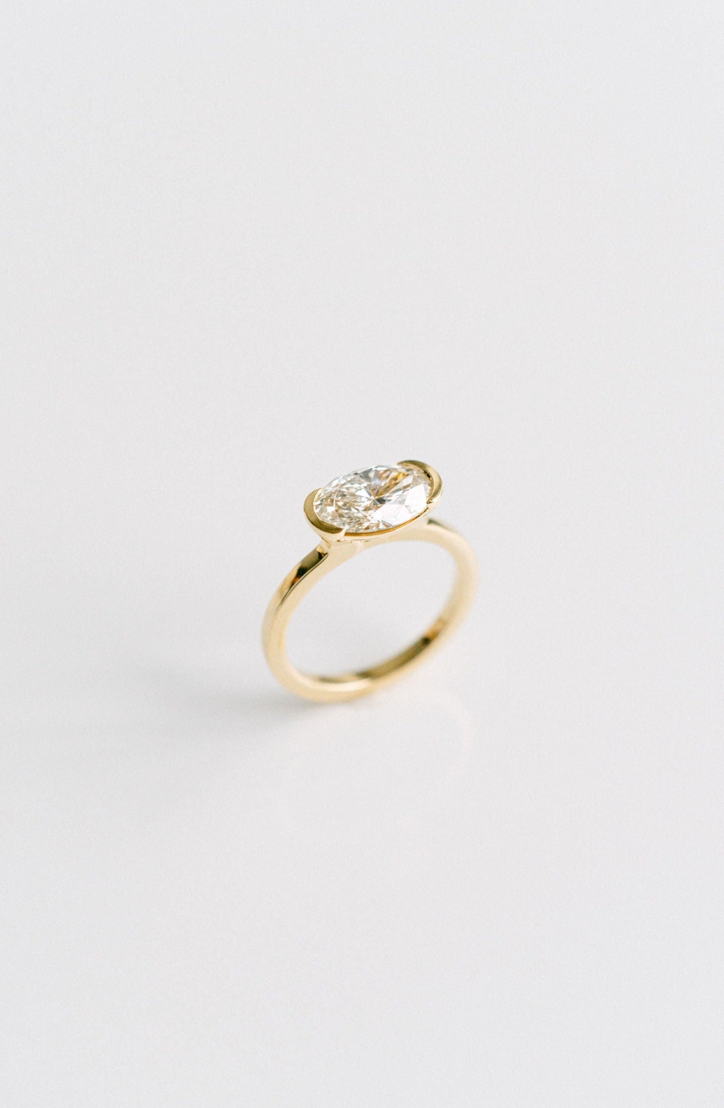 2.50CT Oval Lab Grown Diamond East West Half Bezel Engagement Ring