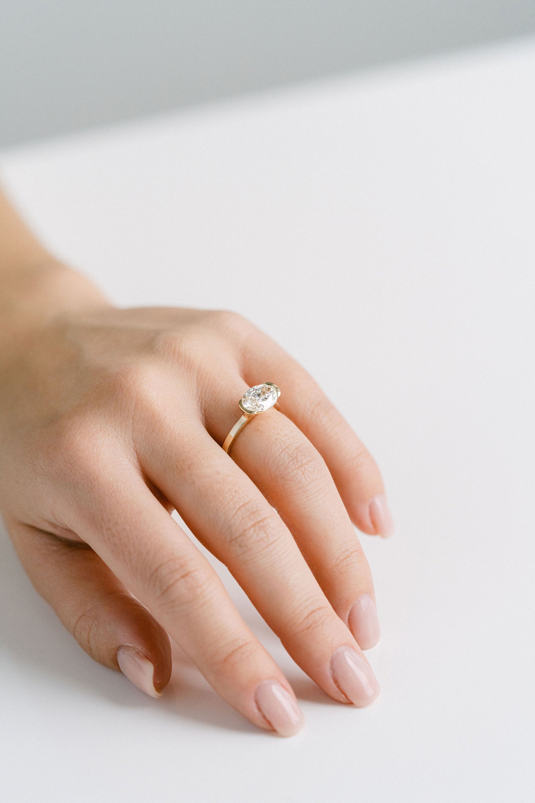 2.50CT Oval Lab Grown Diamond East West Half Bezel Engagement Ring