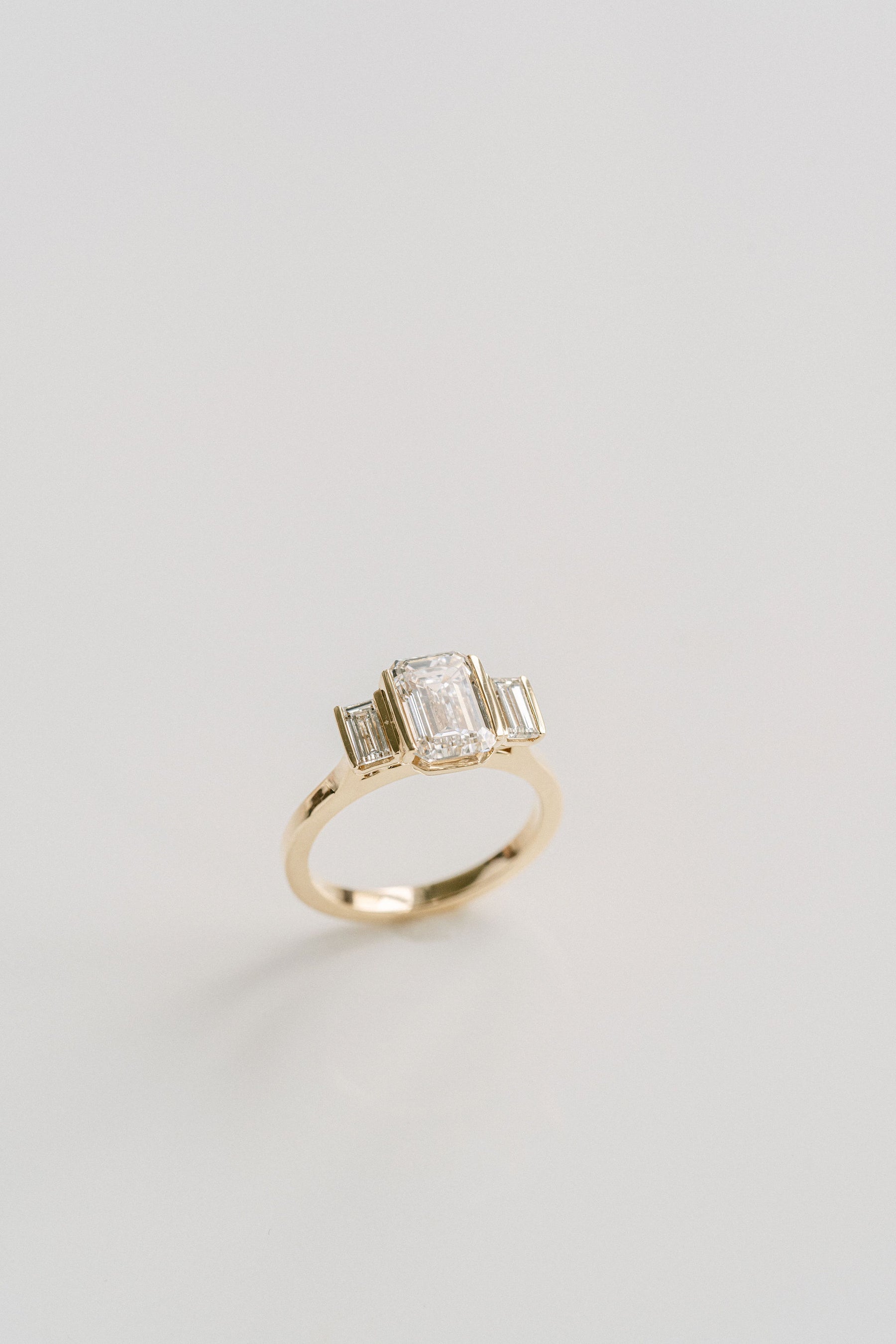 2.0CT Emerald Cut Lab Grown Diamond With Bar Set Baguette Three Stone Engagement Ring