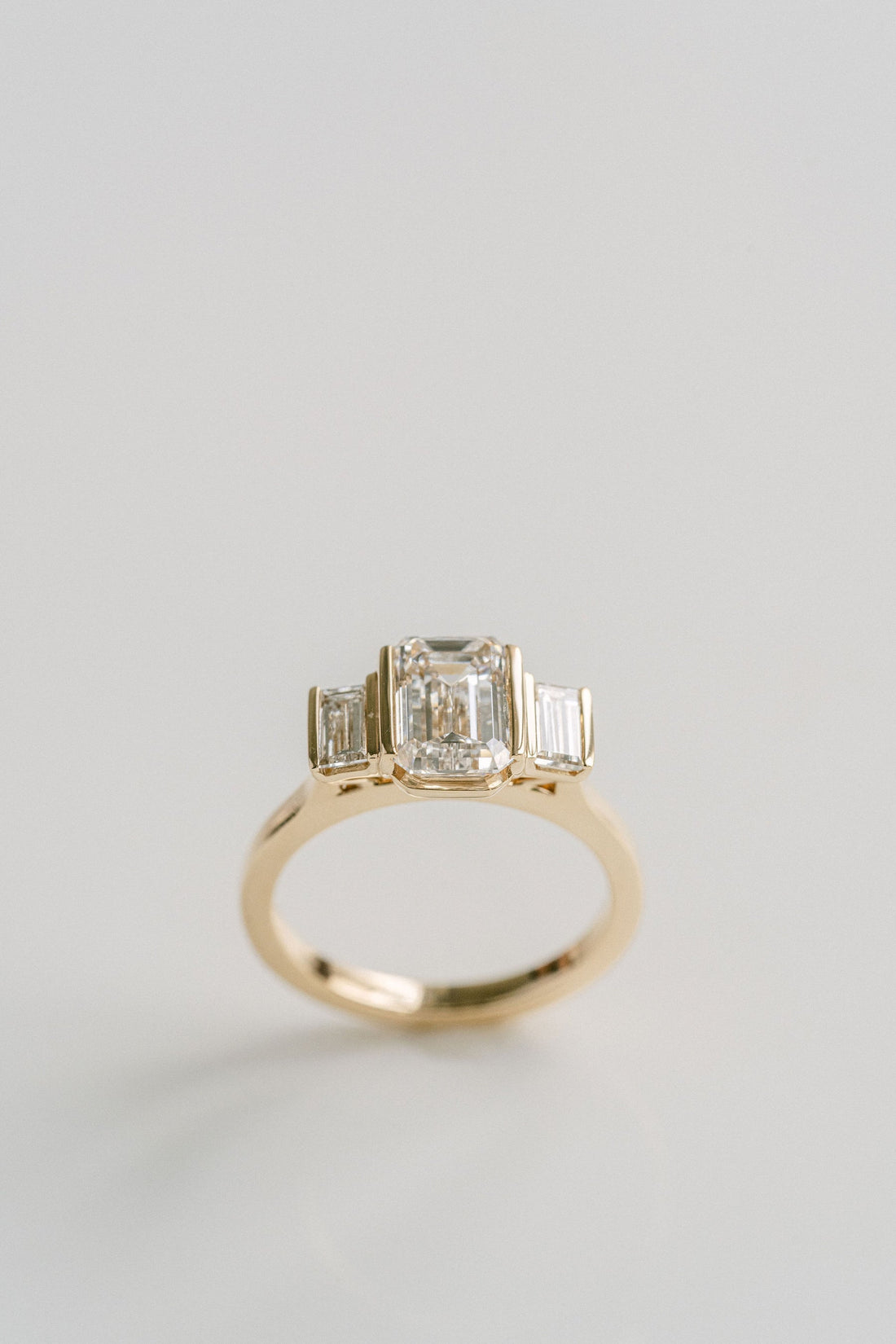 2.0CT Emerald Cut Lab Grown Diamond With Bar Set Baguette Three Stone Engagement Ring