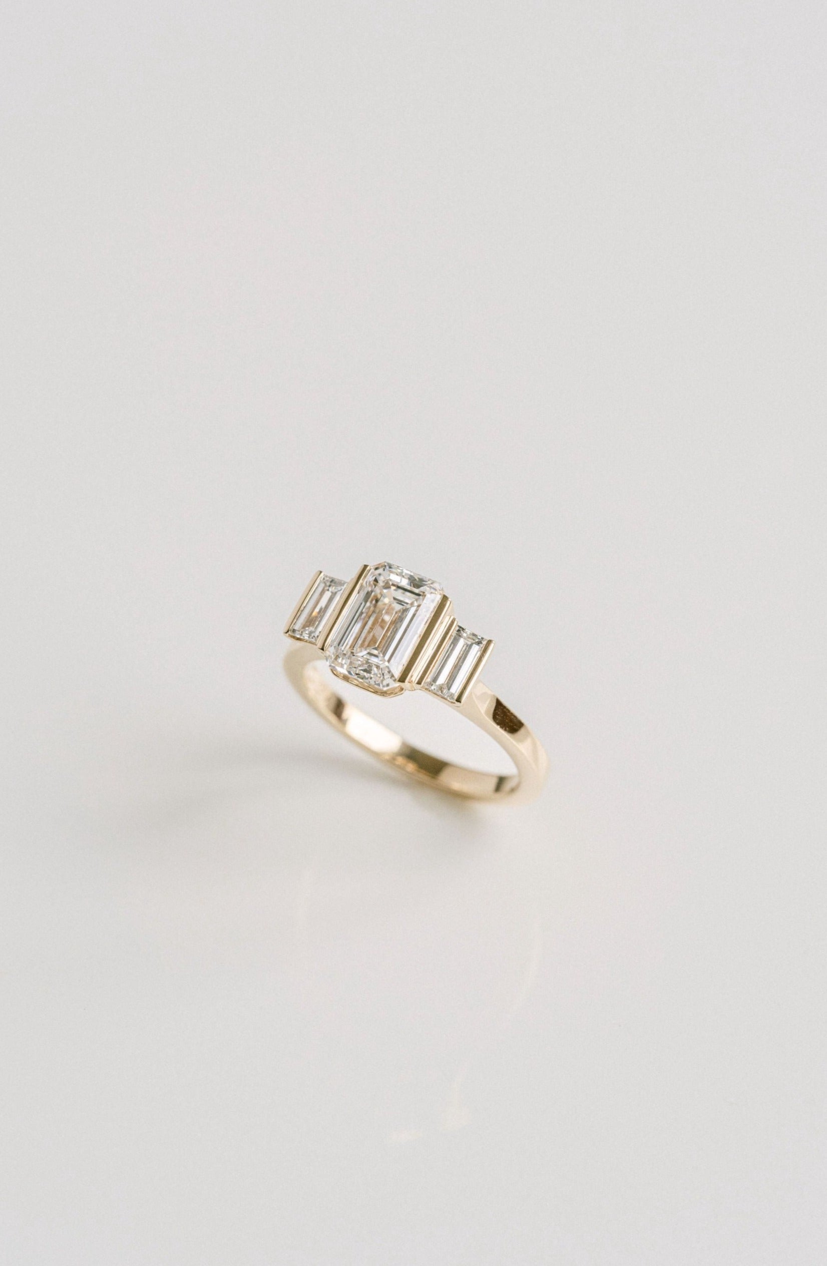 2.0CT Emerald Cut Lab Grown Diamond With Bar Set Baguette Three Stone Engagement Ring