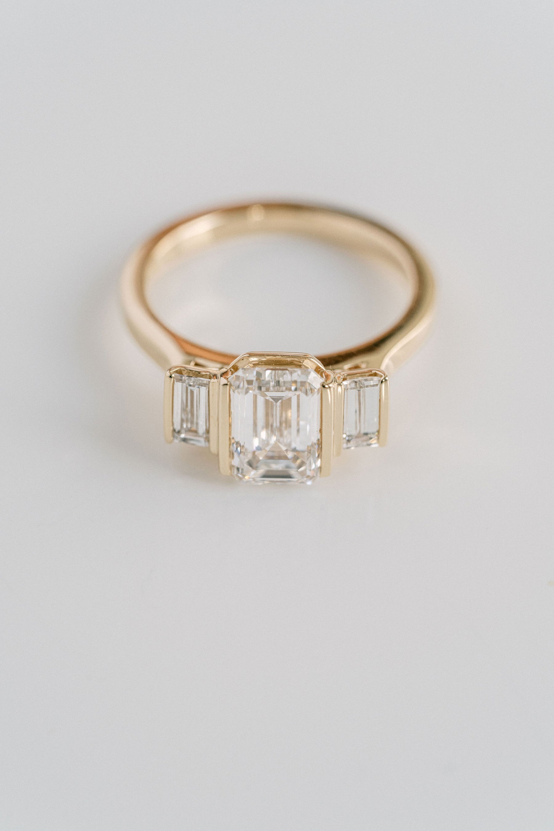 2.0CT Emerald Cut Lab Grown Diamond With Bar Set Baguette Three Stone Engagement Ring