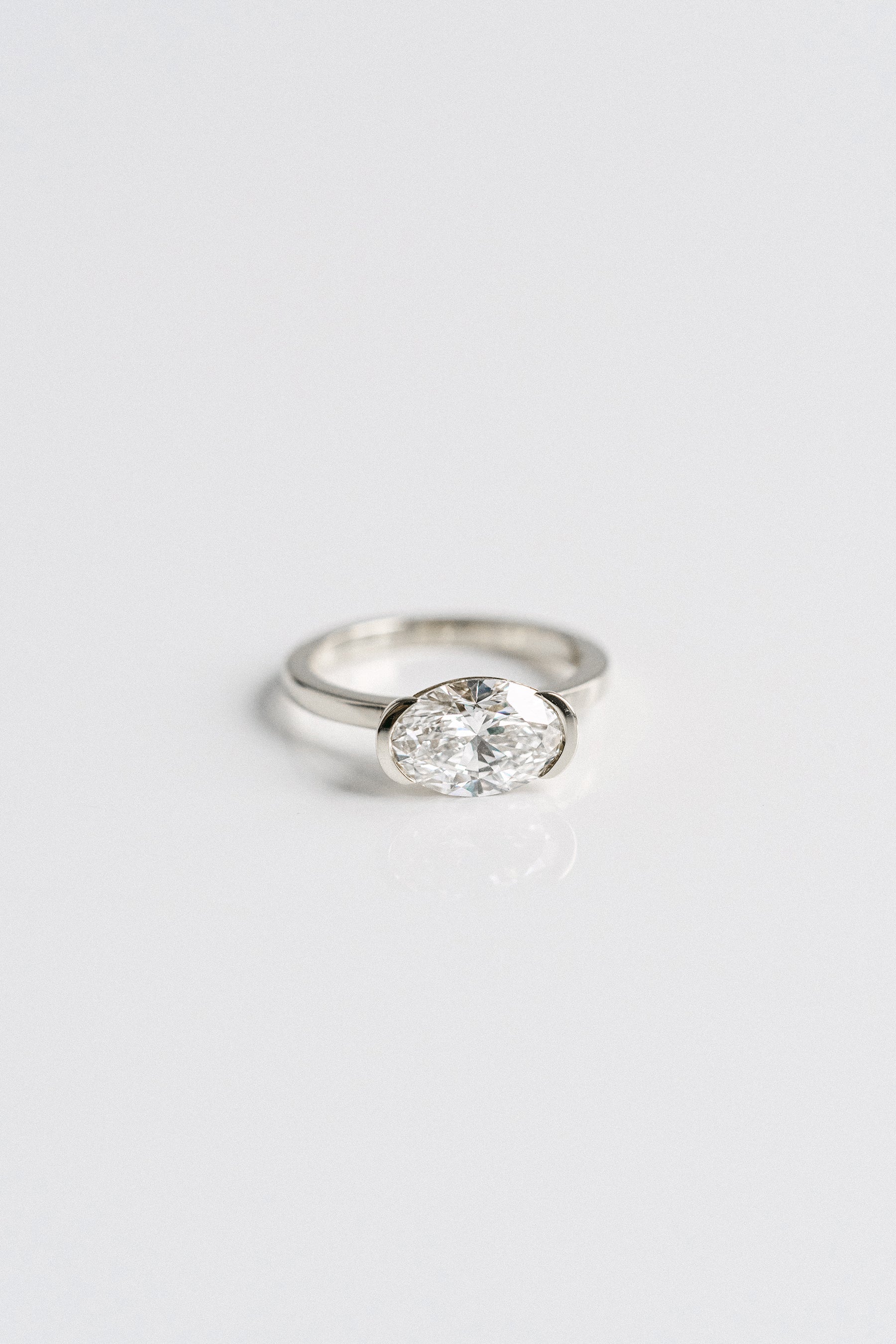 2.50CT Oval Lab Grown Diamond East West Half Bezel Engagement Ring